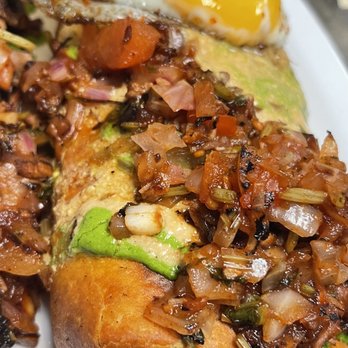 Hate Mondays Tavern - a plate of food with a fried egg on top - Barbeque Near Me - Miami, Florida Hate Mondays Tavern - a plate of food with a fried egg on top - Barbeque Near Me - Miami, Florida
