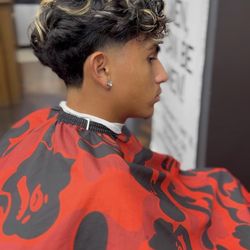 Barbers Cave - Trendy textured haircut with a modern taper fade at Barber's Cave in Woodbridge.