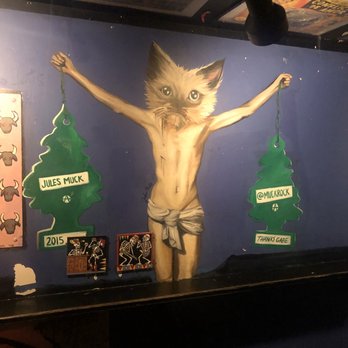 The Matador - Kitty crucifixion? Wall art - Dive Bars Near Me - Santa Fe, New Mexico