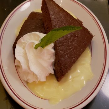 Fountain Cafe - Warm Gingerbread with vanilla custard sauce and whipped cream - New American Near Me - Port Townsend, Washington Fountain Cafe - Warm Gingerbread with vanilla custard sauce and whipped cream - New American Near Me - Port Townsend, Washington