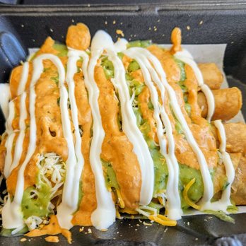 Roll Em Up Taquitos - 4 beef taquitos with all toppings - Tacos Near Me - Corona, California Roll Em Up Taquitos - 4 beef taquitos with all toppings - Tacos Near Me - Corona, California