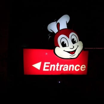 Jollibee - Entrance sign at night. - Fast Food Near Me - Daly City, California