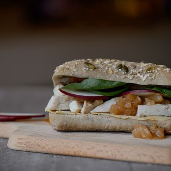 Ladouceur du Terroir - a sandwich on a cutting board - Cafes Near Me - Saint-Eustache, Quebec Ladouceur du Terroir - a sandwich on a cutting board - Cafes Near Me - Saint-Eustache, Quebec