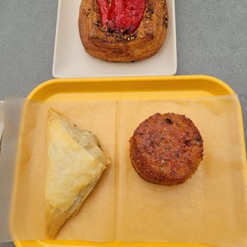 SOFRA Bakery & Cafe - Shishito Pepper Croissant Tart (top), Spanakopita (bottom left), and Black Sea Cornbread (bottom right) - Middle Eastern Near Me - Cambridge, Massachusetts SOFRA Bakery & Cafe - Shishito Pepper Croissant Tart (top), Spanakopita (bottom left), and Black Sea Cornbread (bottom right) - Middle Eastern Near Me - Cambridge, Massachusetts
