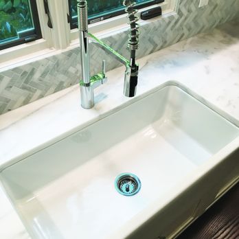 Hermes Designs - a kitchen sink with a faucet - Interior Design Near Me - Great Neck, New York