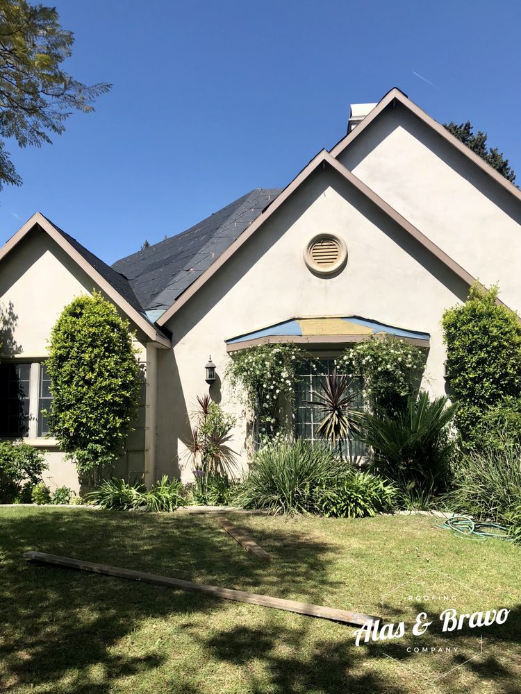 Slide of Alas & Bravo Roofing Company