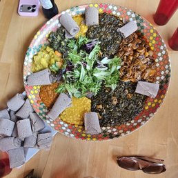 Family style... Chicken Tibsy and Spinach,  Mushroom Tibsy and Shewhat Vegan Sampler