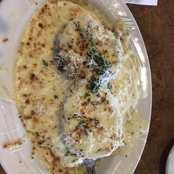 Sutton's - The very cheesy eggplant Parmesan with alfredo sauce. - Italian Near Me - Lexington, Kentucky Sutton's - The very cheesy eggplant Parmesan with alfredo sauce. - Italian Near Me - Lexington, Kentucky