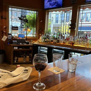 The Quarry Restaurant - a glass of wine on the bar - American Near Me - Mason City, Iowa The Quarry Restaurant - a glass of wine on the bar - American Near Me - Mason City, Iowa