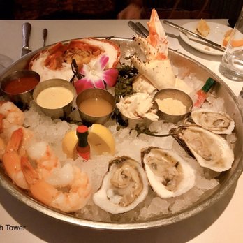 Latitudes - Shellfish Tower. Oysters, shrimp, lobster tail, lump crabmeat, king crab claws. - Seafood Near Me - Highland Beach, Florida Latitudes - Shellfish Tower. Oysters, shrimp, lobster tail, lump crabmeat, king crab claws. - Seafood Near Me - Highland Beach, Florida