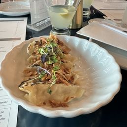 the gyozo umami (pork dumplings with fresh cilantro & fried onions) the gyozo umami (pork dumplings with fresh cilantro & fried onions)