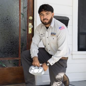 Lasting Legacy Plumbing Heating and Air - Technician putting on shoe savers before entering home. - Plumbing Near Me - Redlands, California Lasting Legacy Plumbing Heating and Air - Technician putting on shoe savers before entering home. - Plumbing Near Me - Redlands, California