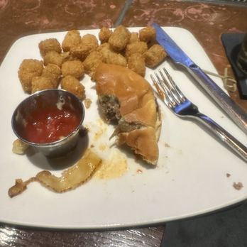 Sweetwater Tavern And Grille - 1/2 eaten juicy burger - American Near Me - Chicago, Illinois Sweetwater Tavern And Grille - 1/2 eaten juicy burger - American Near Me - Chicago, Illinois