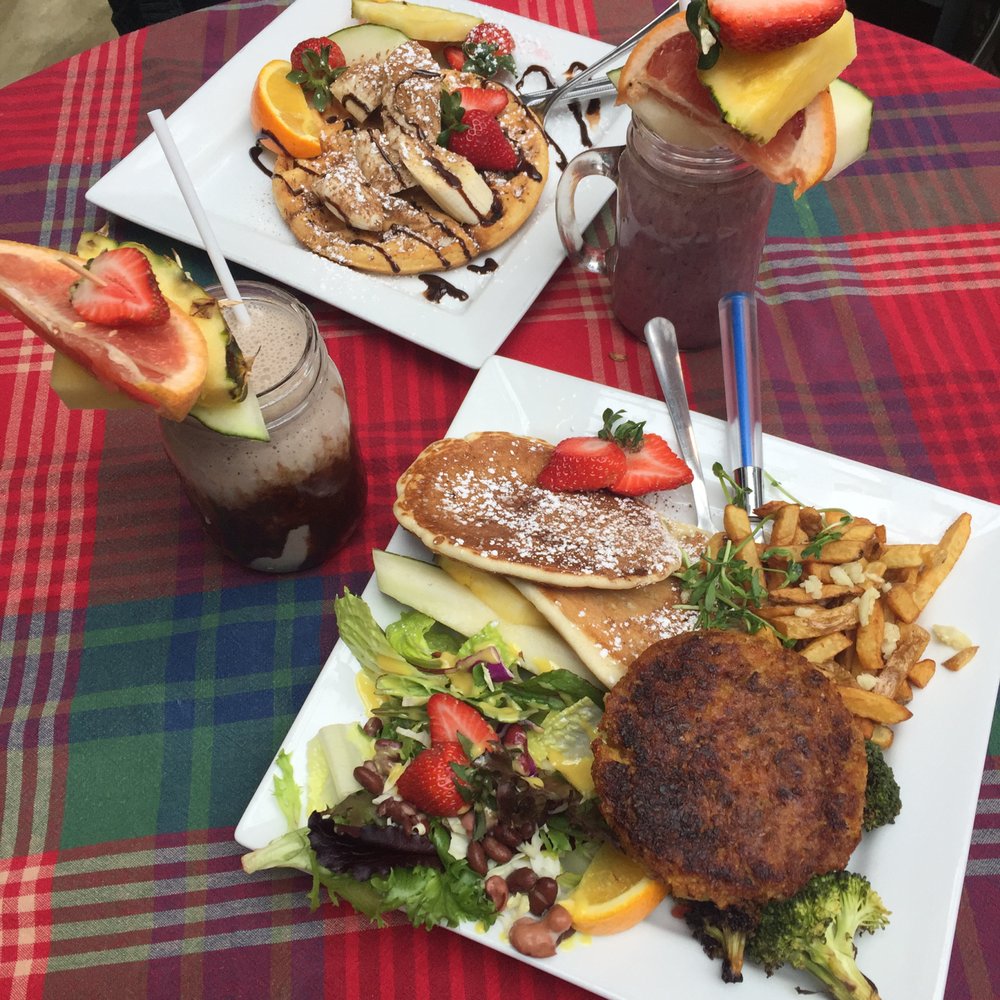 Karine's - Lots going on here: a peanut butter, banana, and chocolate (PBC) waffle; berry smoothie; PBC smoothie; vegan special with potato - Breakfast & Brunch Near Me - Toronto, Ontario Karine's - Lots going on here: a peanut butter, banana, and chocolate (PBC) waffle; berry smoothie; PBC smoothie; vegan special with potato - Breakfast & Brunch Near Me - Toronto, Ontario