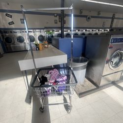 Delaney's Lost Sock Laundromat - Wet clothes thrown into a cart while people are doing their laundry. How I found my clothes this morning smh