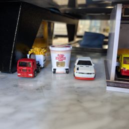 Small cars, tastefully tucked amongst the other decor really adds personality to the spot