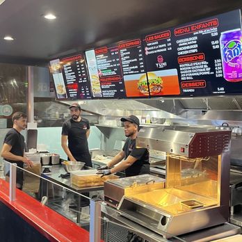 Yumi Burger - a group of people preparing food - Burgers Near Me - Montreal, Quebec Yumi Burger - a group of people preparing food - Burgers Near Me - Montreal, Quebec