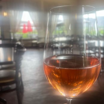 Kismet Estate Winery - a hand holding a glass of wine - Wineries Near Me - Oliver, British Columbia Kismet Estate Winery - a hand holding a glass of wine - Wineries Near Me - Oliver, British Columbia