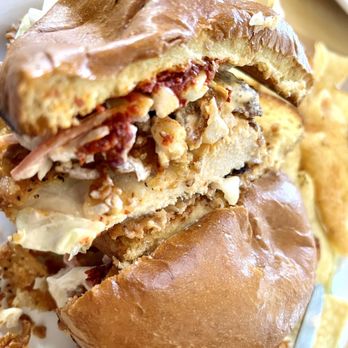 Greenside Cafe - Chicken breast, buttermilk battered and fried, topped with a gochujang aioli and kimchi slaw. PERFECTION on a brioche bun. - Beer Bar Near Me - Cedar Crest, New Mexico
