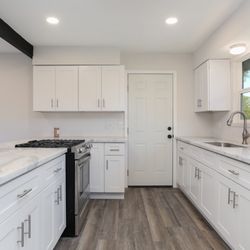 Cabinet Depot - After photo : flooring, countertops, & cabinets were all purchased and installed from Israel & his referrals