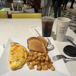 Western Omelette platter with hash browns and rye toast. Large coffee and soda.