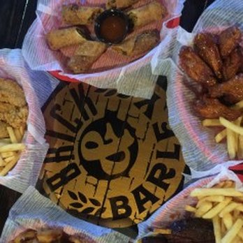 Brick & Barley - a variety of food items arranged in a circle - Bars Near Me - Orange, Texas