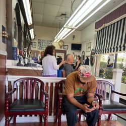 Sam & Roy's University Barber Shop - Very busy , in the morning. Come early or after