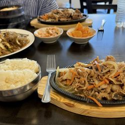 Seoul Bunsik - Pork bulgogi, japchae, rice, and kimchi side dishes.