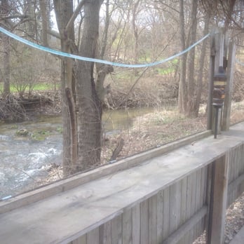 City Limits - a stream running through a wooded area - Bars Near Me - Utica, Illinois