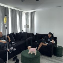 Serenity Mobile IV - Our clients relaxed on their couch, enjoying our IV therapy. Comfort, convenience, and results, all from home!