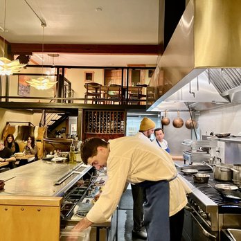 SKADI - a group of people in a kitchen preparing food - Modern European Near Me - Mammoth Lakes, California