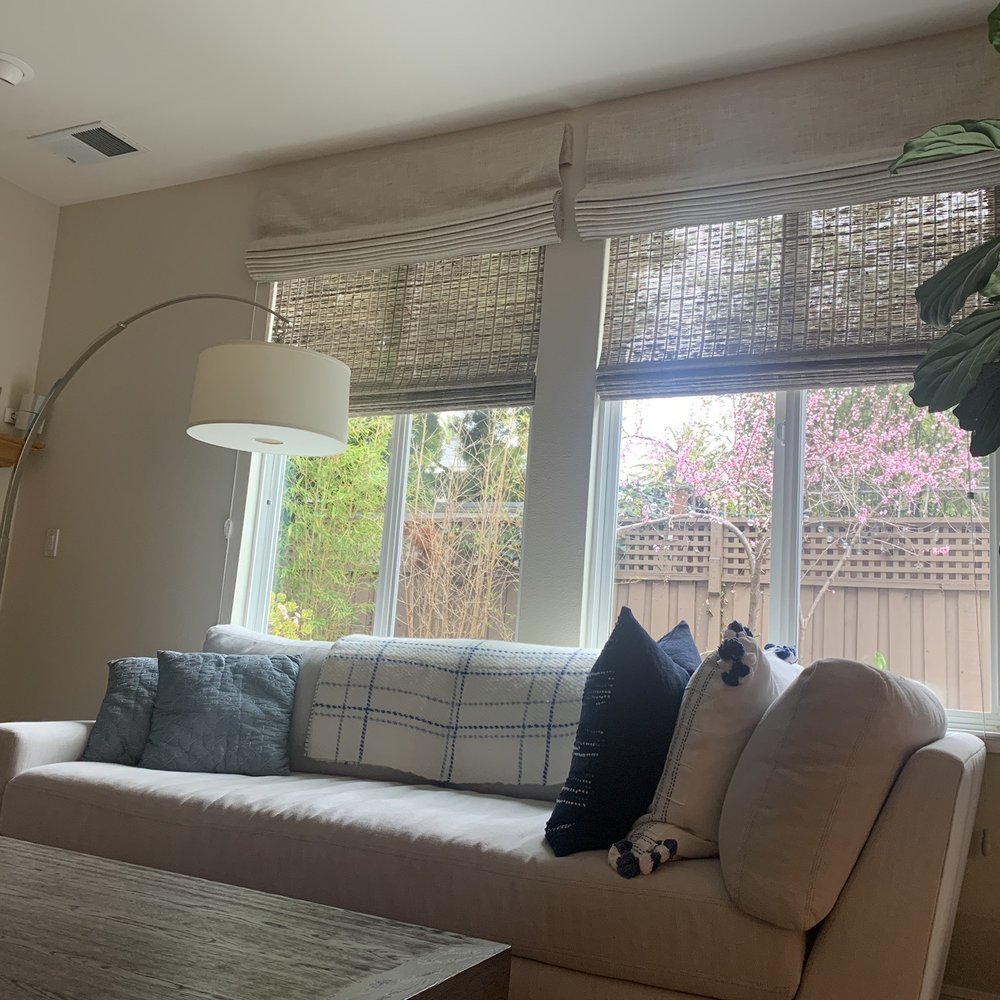 Double layer Roman shade w/blackout liner with woven wood shade for filtered light. Great for day /night pending light & privacy needs.