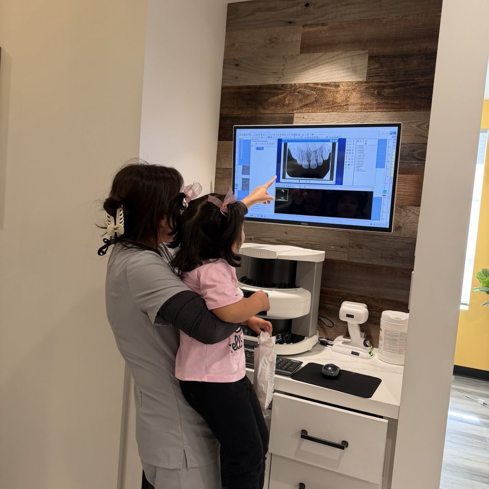 Dr Grace showing our daughter her X-rays Dr Grace showing our daughter her X-rays