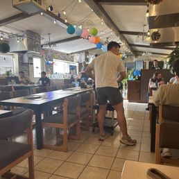Restaurant with grills in each table Restaurant with grills in each table