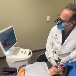 Stunning Smiles - Las Vegas dentist Dr. Richard Racanelli working on dental crown procedure using Sirona CEREC intraoral scanner at Stunning Smiles of Las Veg