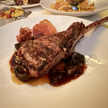 The Capital Grille - Tomahawk Veal Chop with Sage Butter, Marsala Jus and Crispy Prosciutto - Seafood Near Me - Fort Worth, Texas The Capital Grille - Tomahawk Veal Chop with Sage Butter, Marsala Jus and Crispy Prosciutto - Seafood Near Me - Fort Worth, Texas