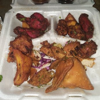 Mango Tree - Variety of pakora, samosas and sauce that come with the platter. (This is after I ate about half of it) - Indian Near Me - Spokane, Washington