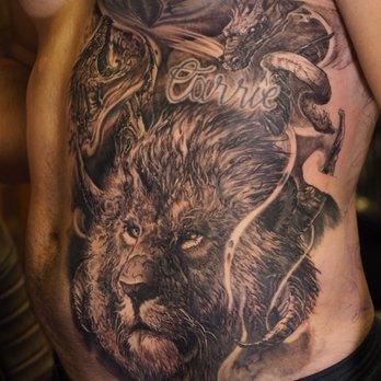 Tattoo Technique - Side piece, rib piece of lion with seven horns and snakes around it. - Tattoo Near Me - Clarksville, Tennessee