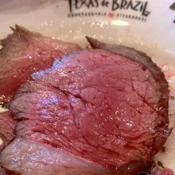 Texas de Brazil - Miami Dolphin Mall - Closer look of the juicy Garlic Picanha. - Steakhouses Near Me - Miami, Florida