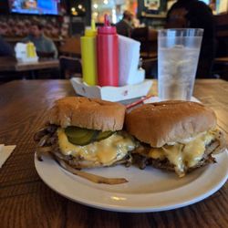 Brew Brothers Slider Bar and Grill - Two Double Cheeseburgers, mixture of Brisket, Chuck & Short Rib 2.5 oz each, served with American cheese, grilled onions & pickles.