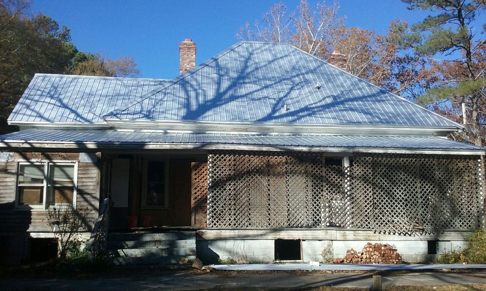 Slide of Tim's Roofing