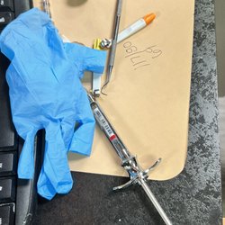 Bella Smiles - Dr. Kaur doesn't re-Cap her needle. Leaving it there for a patient or staffing to grab and potentially get hurt.