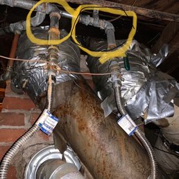 Galvanized, copper, and who-knows-what, all congregating around the heating system and the original chimney to the wood stove. Galvanized, copper, and who-knows-what, all congregating around the heating system and the original chimney to the wood stove.