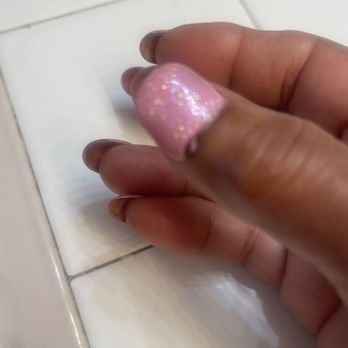 Lovely Nails - Picture of my thumb nail after telling the tech I did not like the shape I received. - Nail Salons Near Me - Seaside, California