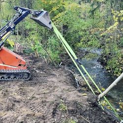 360 Tree Service & Clean up  - Restructuring a pond dam, placing concrete on creek side.
