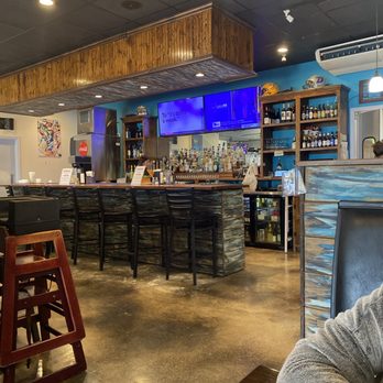 John Michael's Good Eats - a man sitting at a bar - American Near Me - Geismar, Louisiana John Michael's Good Eats - a man sitting at a bar - American Near Me - Geismar, Louisiana