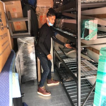 Move N Packs - Mikey stacking a truck. - Movers Near Me