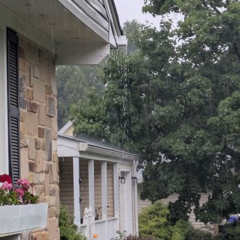 Ned Stevens Gutter Cleaning - Another side overflowing after three months of new gutters. - Gutter Services Near Me - Laurel, Maryland