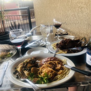 Dolce Vita Italian Bistro - Chicken piccata, and side of spaghetti, to the right is the lamb oso bucco, the perfect meal with a nice Chianti - Italian Near Me - Tucson, Arizona Dolce Vita Italian Bistro - Chicken piccata, and side of spaghetti, to the right is the lamb oso bucco, the perfect meal with a nice Chianti - Italian Near Me - Tucson, Arizona