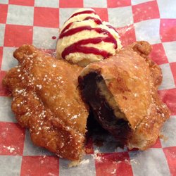 31 South Barbecue - Fresh Fried Chocolate Fried Pie with vanilla ice cream and raspberry sauce.